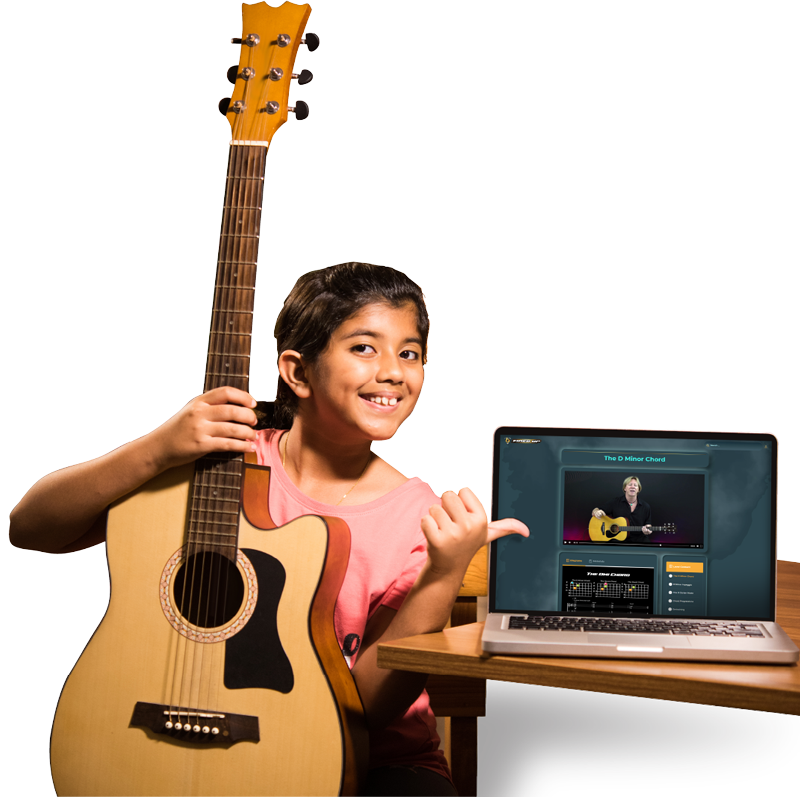 Girl holding a guitar and pointing at Fired Up digital platform on a laptop